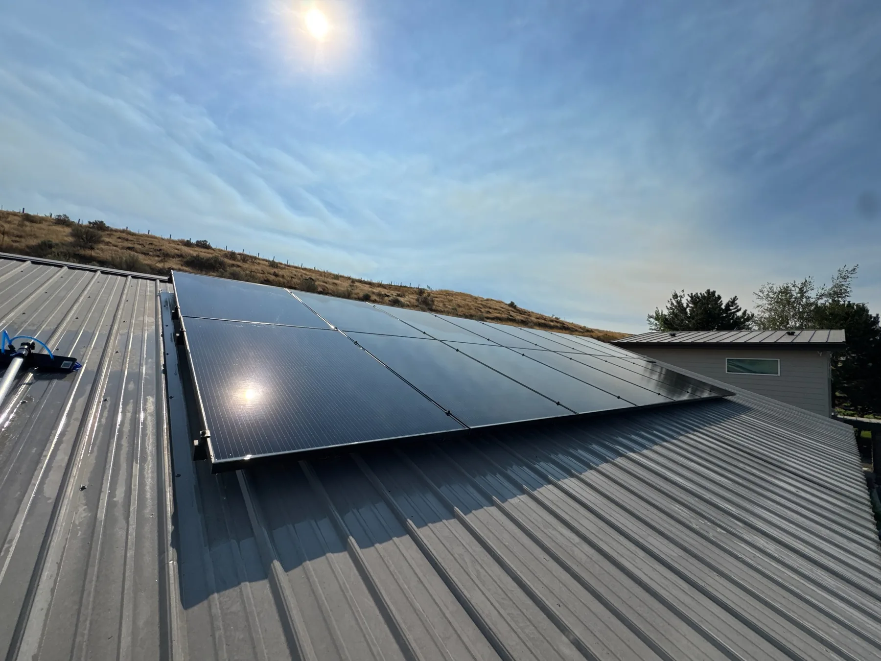 Clean solar panels on a metal roof after service in the Tri-Cities Washington