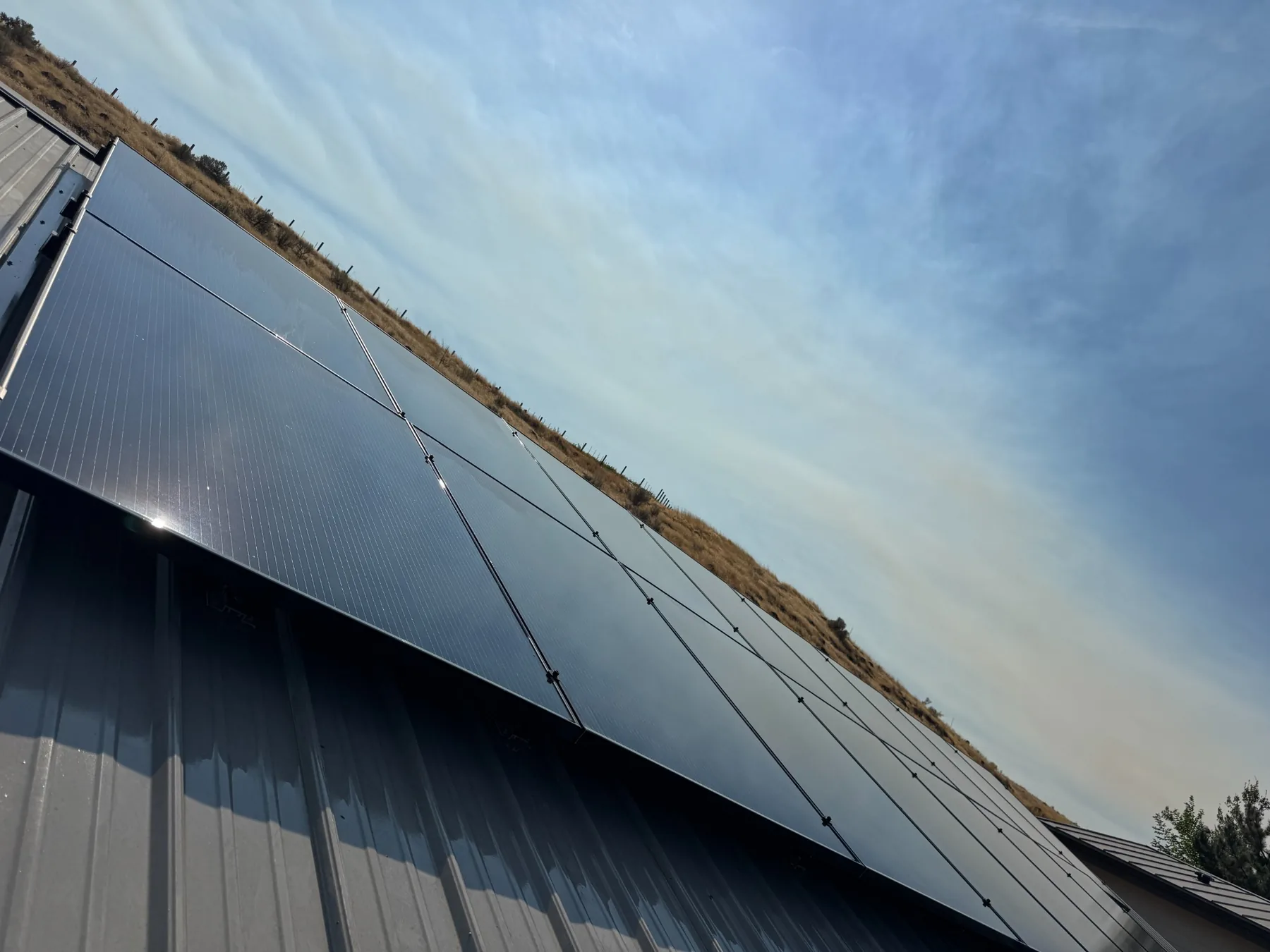 Clean solar panel array on a metal roof in the Tri-Cities Washington