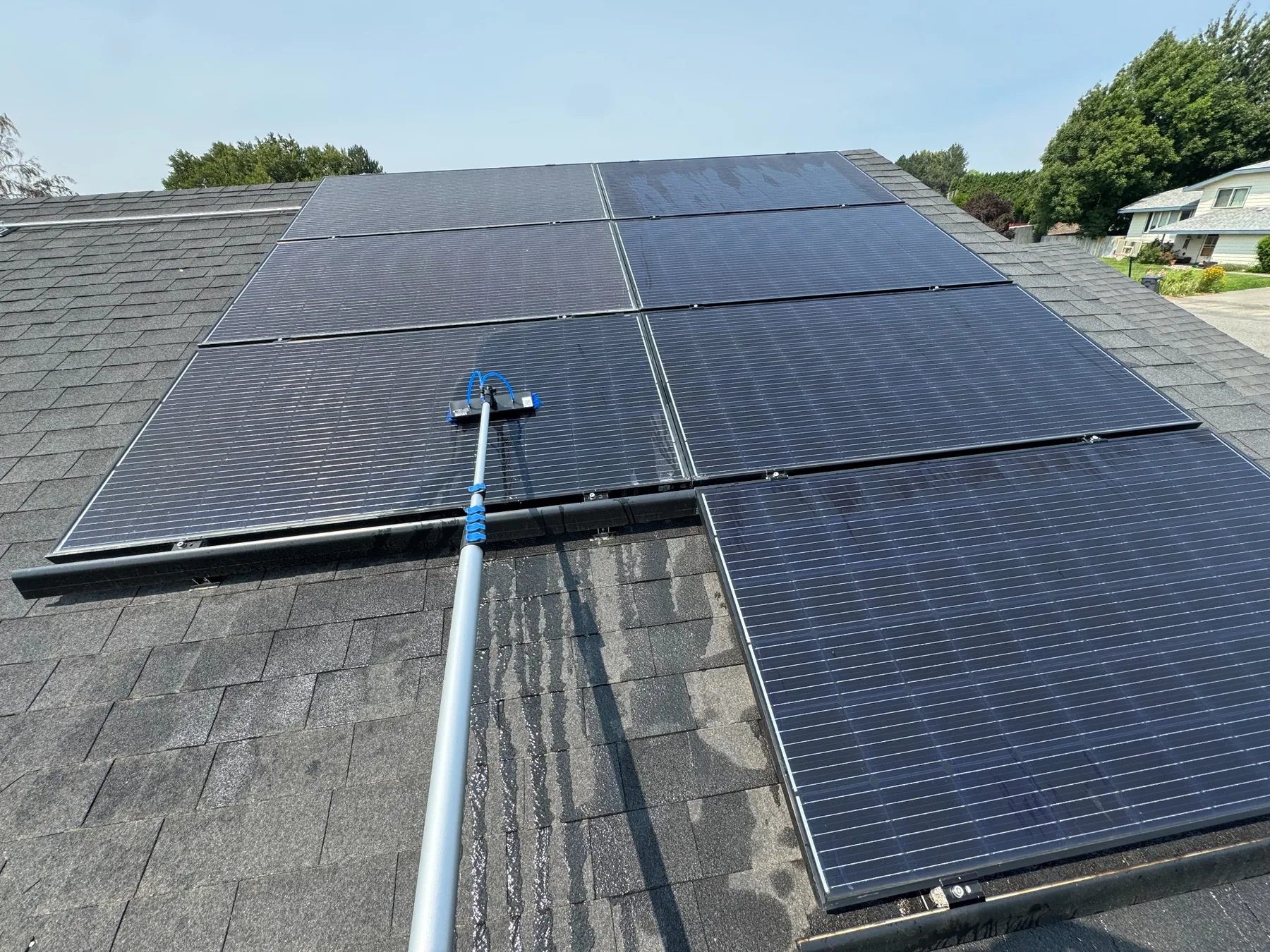 Water-fed brush cleaning solar panels in the Tri-Cities Washington